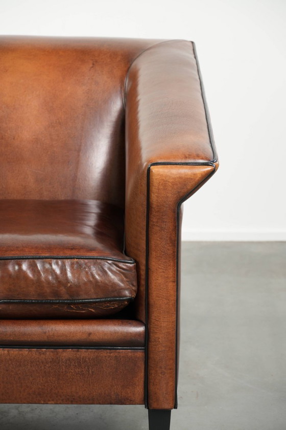 Image 1 of Sheepskin Art Deco design armchair with black piping