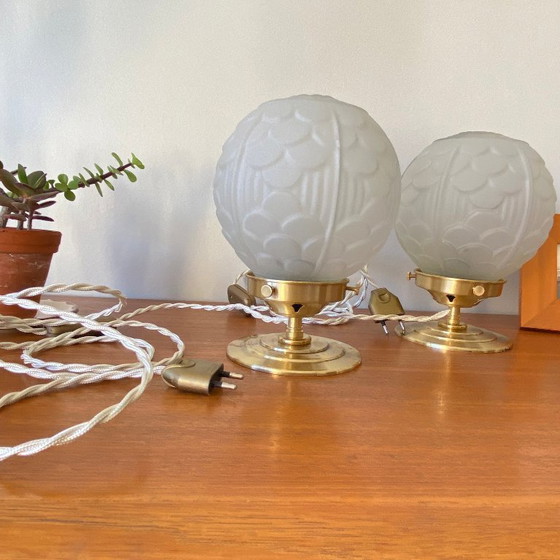 Image 1 of Pair of vintage bedside lamps with antique glass globes and brass bases, circa 1950