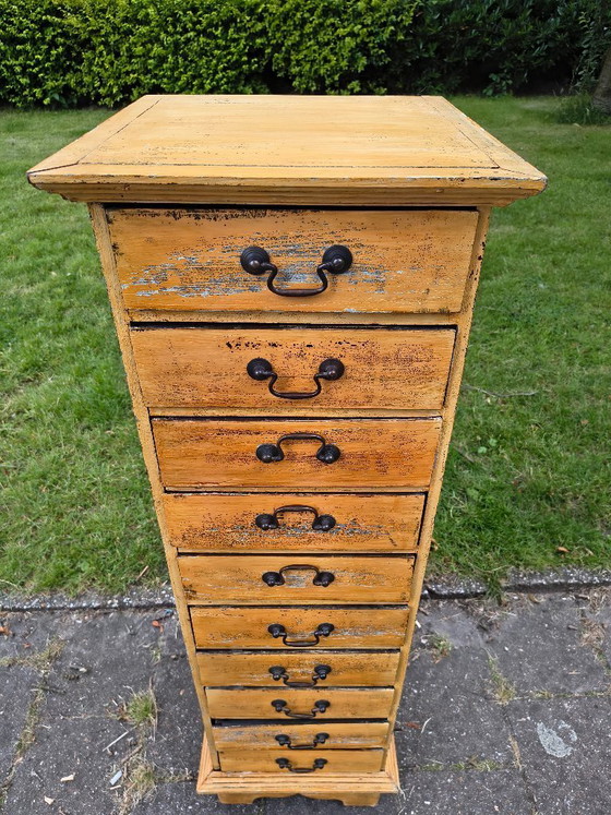 Image 1 of Vintage ochre yellow chest of drawers / apothecary