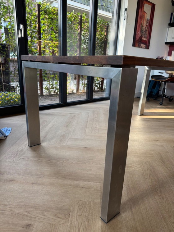 Image 1 of Walnut wood table with stainless steel legs