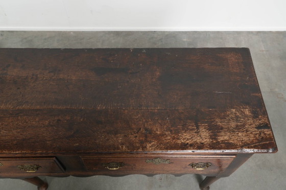 Image 1 of Large English antique oak sideboard/dresser with 3 working drawers from the early 18th century with a beautiful patina