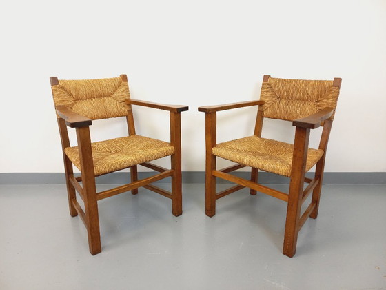 Image 1 of Suite van 2 vintage Brutalistische fauteuils in eiken en stro uit de jaren 60