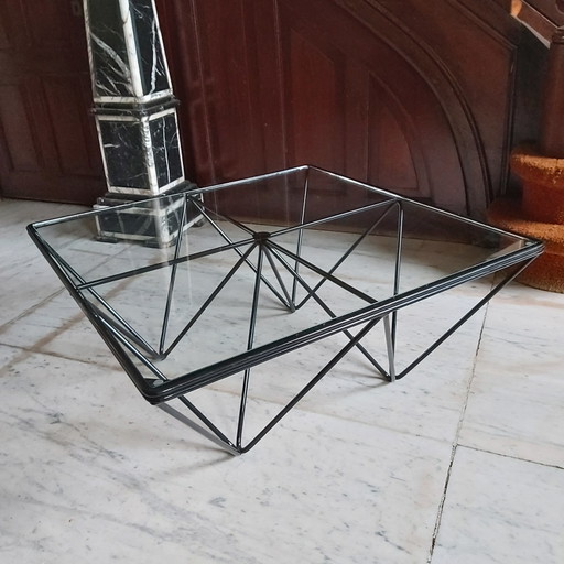 Beautiful modern coffee table in black lacquered metal and glass top