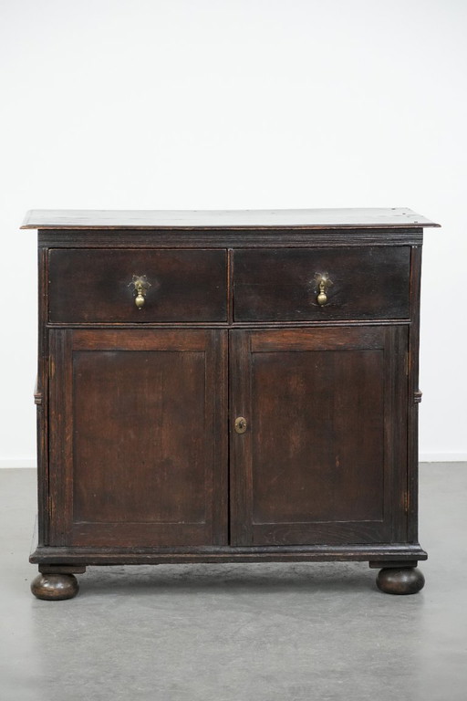 Rare English antique 2-door cabinet from the early 18th century with ball feet