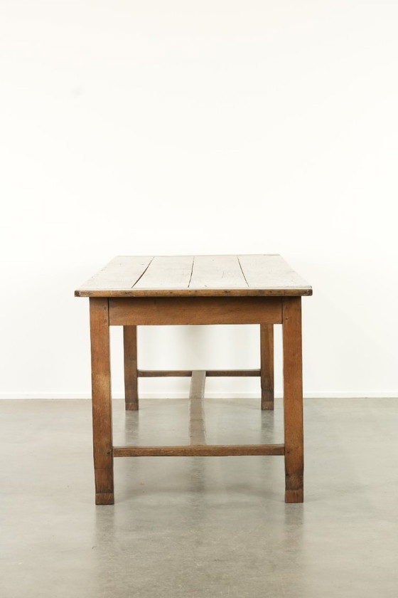 Image 1 of Large antique French farmhouse dining table made of oak from the early 1800s