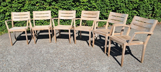 Image 1 of 6 Traditional Teak stacking chairs with armrests