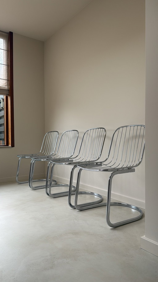 Vier Gastone Rinaldi stoelen verchroomd staal