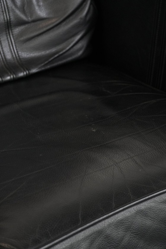 Image 1 of 2 x Black cowhide Art Deco design armchairs with high backs by Schuitema