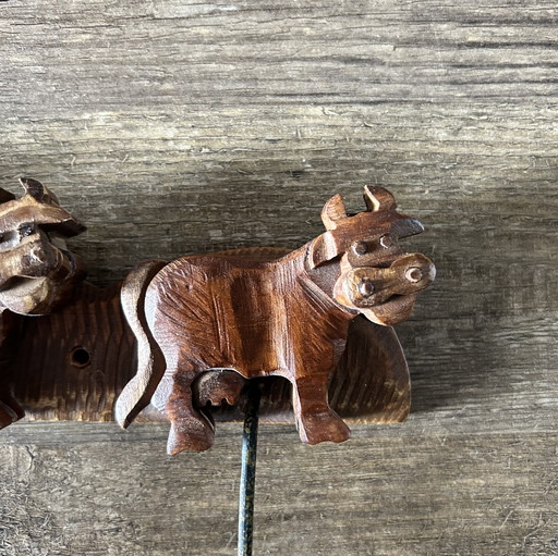 Vintage wooden cow coat rack