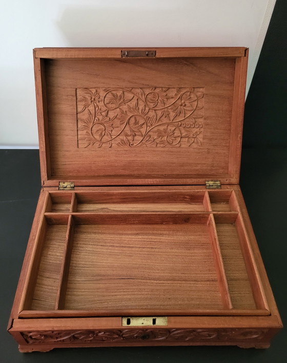 Image 1 of Hand-engraved wooden jewelry box with peacock and floral motifs.