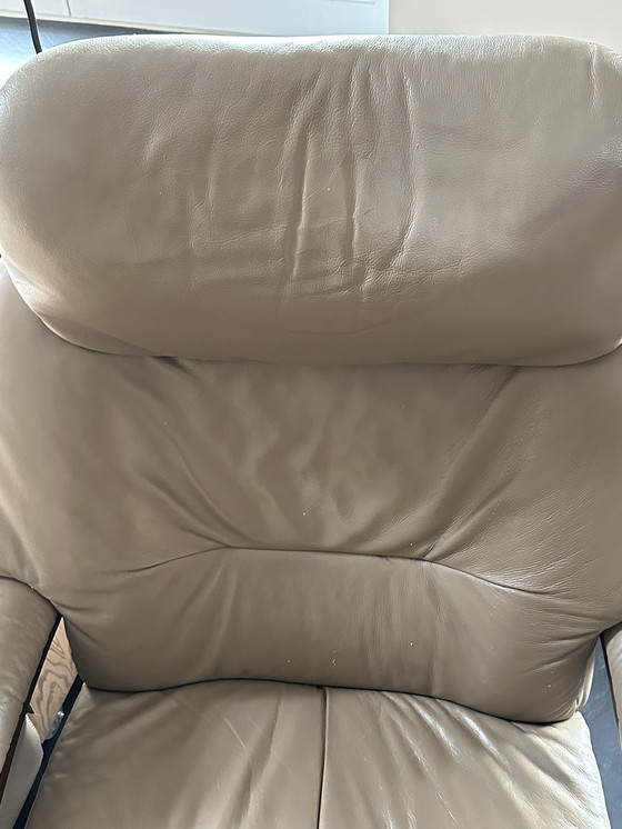 Image 1 of Taupe armchair with footstool