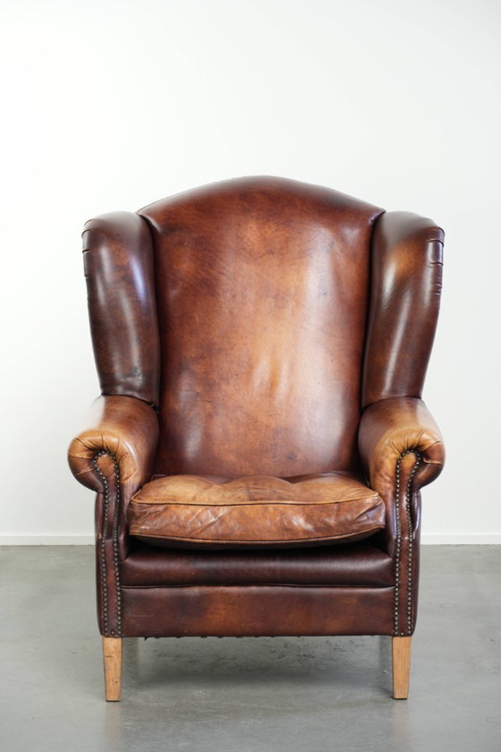 Image 1 of Comfortabele rundleren oorfauteuil in Engelse stijl met een prachtige warme kleurstelling en een karaktervolle uitstraling