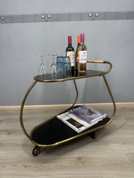 Chariot de service vintage avec plateaux en verre fumé