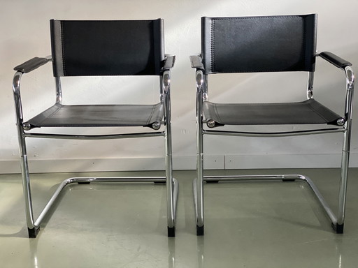 2x Vintage zwarte buisframe stoelen