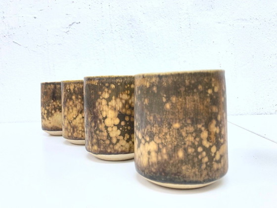 Image 1 of   1 jug and 4 mugs from the 50s 60s by Gotlind Weigel.  Ceramic.  Good used condition. Some chips to the rim