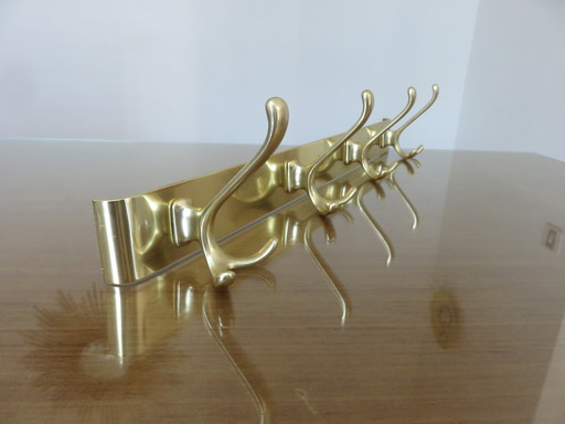 Large wall-mounted coat rack in gilded aluminum, France, 1970