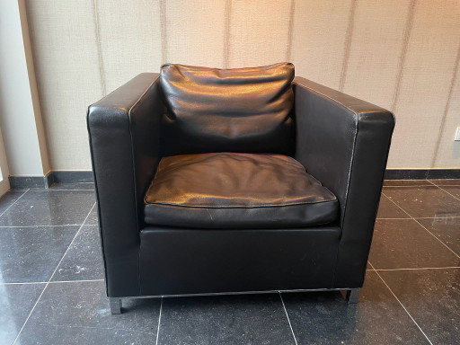 Two brown Molinari armchairs