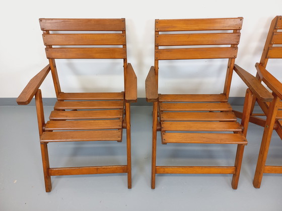 Image 1 of Vintage garden furniture consisting of a table with extensions and 4 wooden armchairs from the 60s