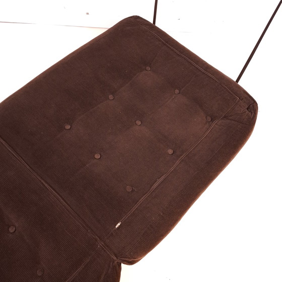 Image 1 of Poltrona letto vintage anni '70, in velluto a coste marrone con bottoni decorativi.