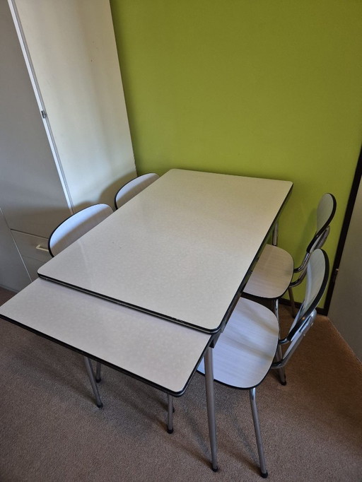 Formica extendable table with 4 chairs from the 1970s