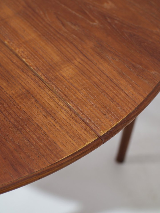 Image 1 of Extendable round dining table oval Danish teak vintage