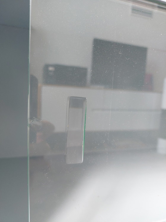Image 1 of Sideboard with glass sliding doors and rounded shapes