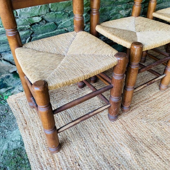 Image 1 of Set van 4 massief houten stoelen met rieten zittingen