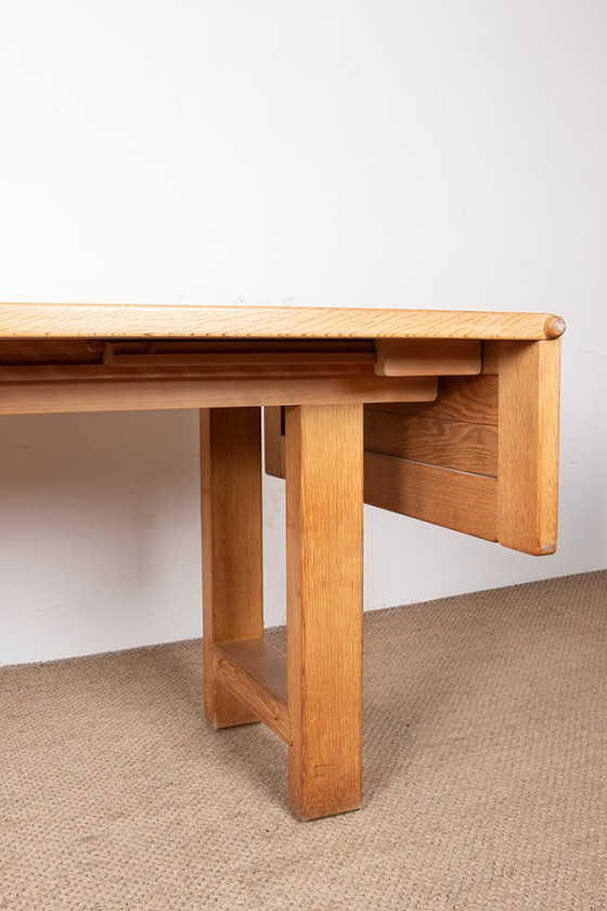 Image 1 of Gran mesa de comedor extensible de roble macizo, diseñada por Guillermo y Chambron en 1960.