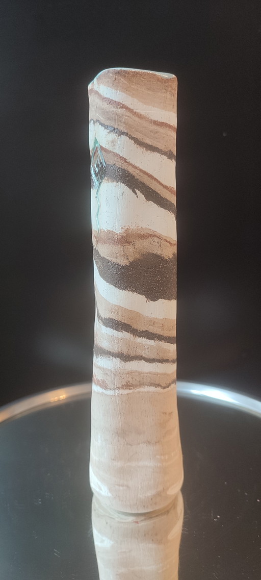 Turned stoneware vase, signed, with relief decoration