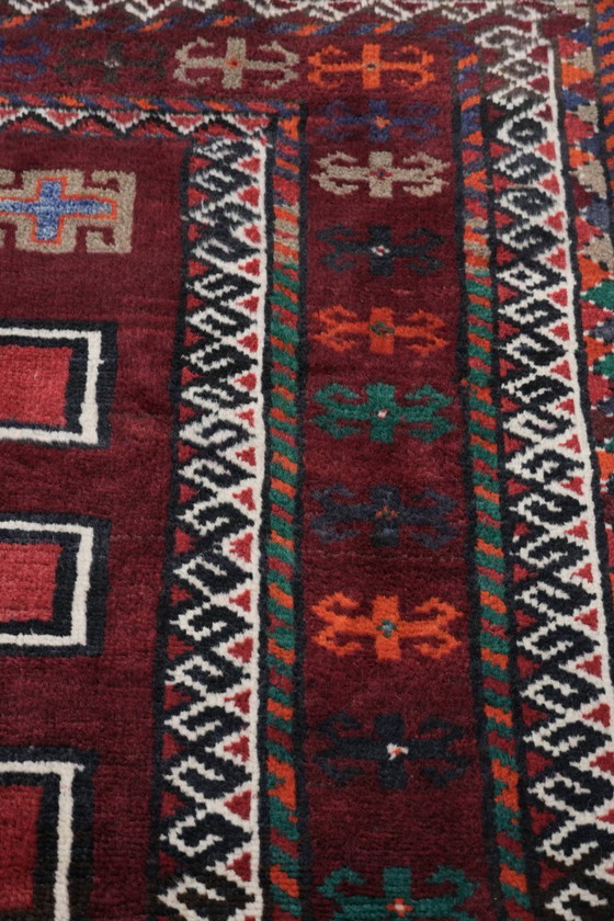 Image 1 of Mooi handgeknoopt vloerkleed van 308x210cm is oosterse stijl met mooie voornamelijk rode kleuren