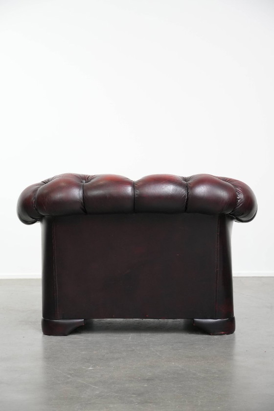 Image 1 of Rode rundleren chesterfield buttonseat fauteuil