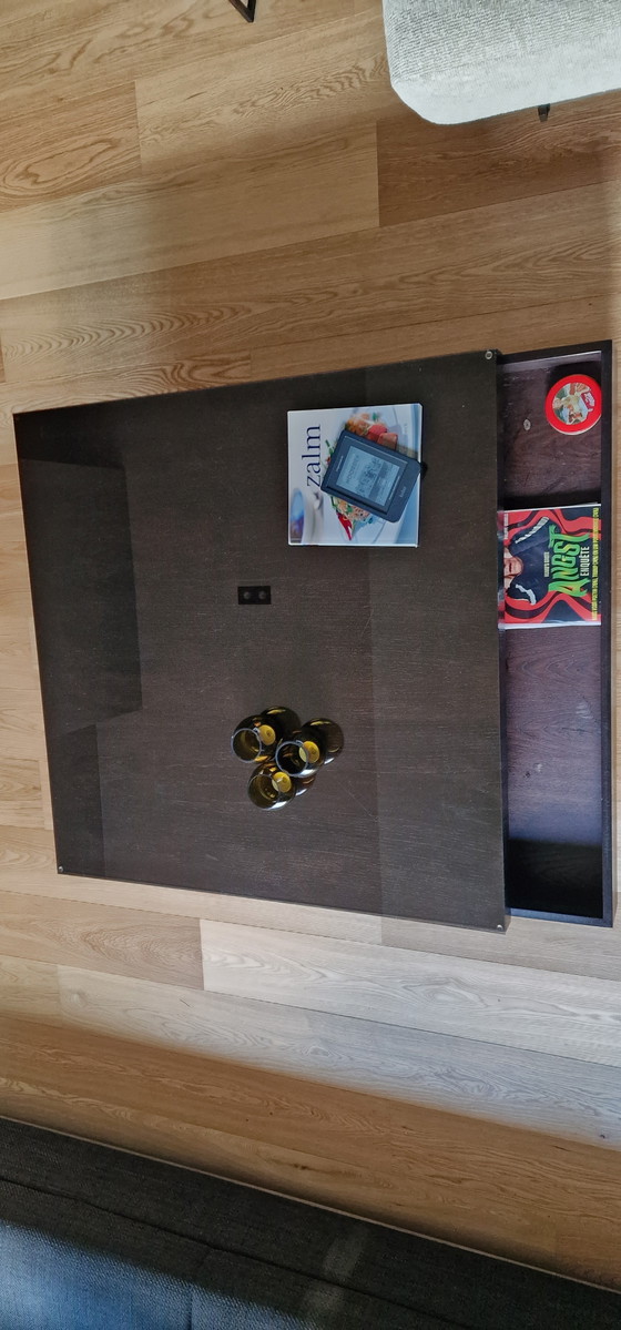 Image 1 of Veneer coffee table with dark glass top