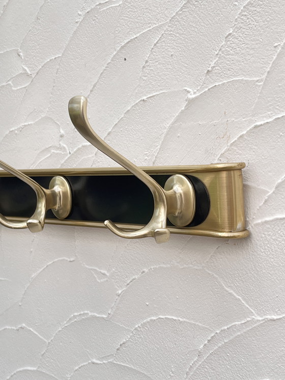 Image 1 of Kleiderständer aus goldfarbenem Aluminium