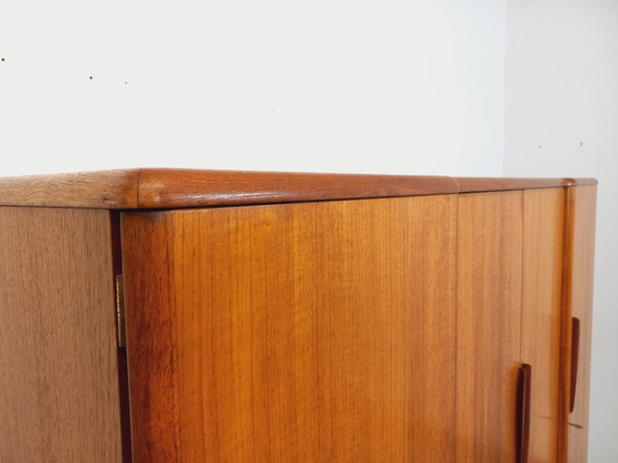 Image 1 of Scandinavische vintage kledingkast in teakhout uit de jaren 60 van ontwerpers Tricoire en Vecchione voor "Meubles TV Paris".