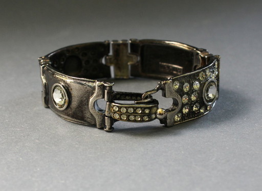 Bracelet by Luigi Briglia, silver-colored, set with clear, faceted stones and signed.
