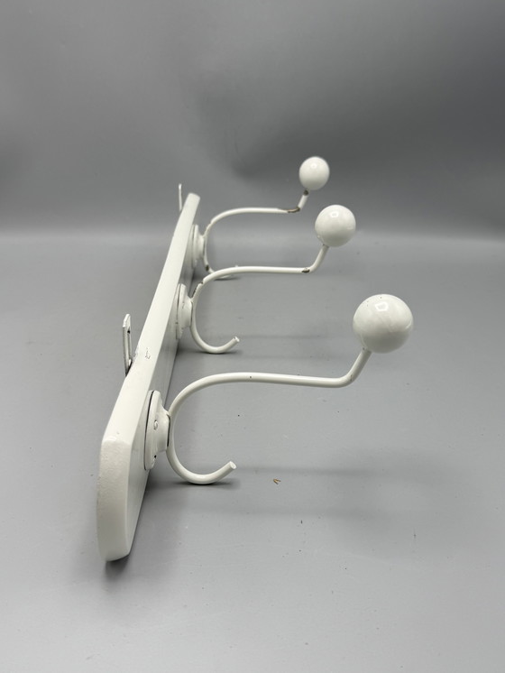 Image 1 of Mid - Century coat rack sleek and timeless design