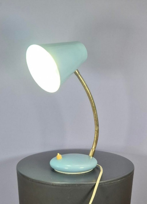 Massive desk lamp in light blue pastel.