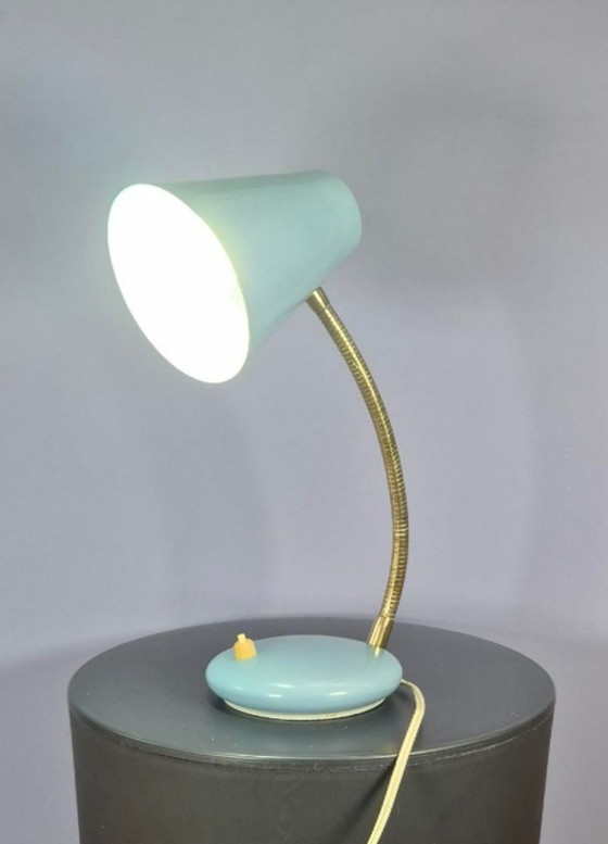 Image 1 of Massive desk lamp in light blue pastel.