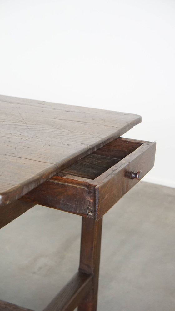 Image 1 of Antique early 19th century French dining table made of oak with 1 drawer