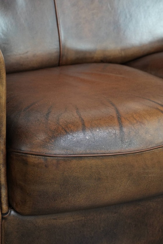 Image 1 of Vintage stoere 2-zits clubbank gemaakt van schapenleer