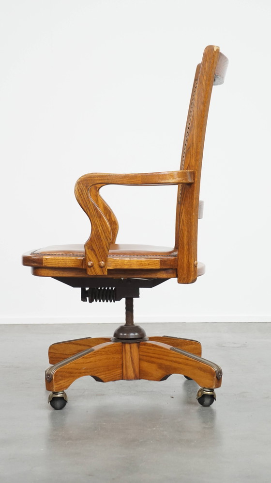 Image 1 of Cognac Colored Leather Office Chair on Wheels with Wood and a Wicker Matted Backrest