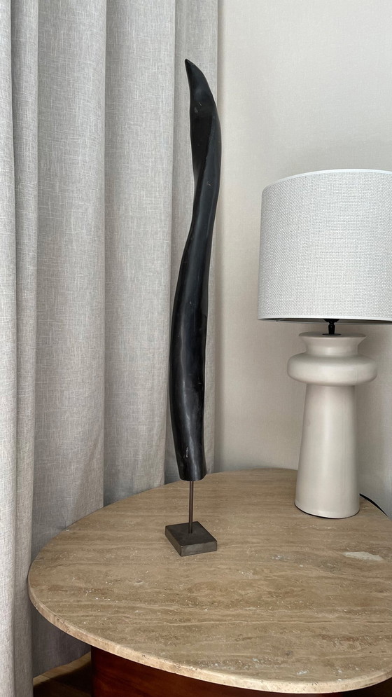 Image 1 of Large black longhorn sculpture on an iron base