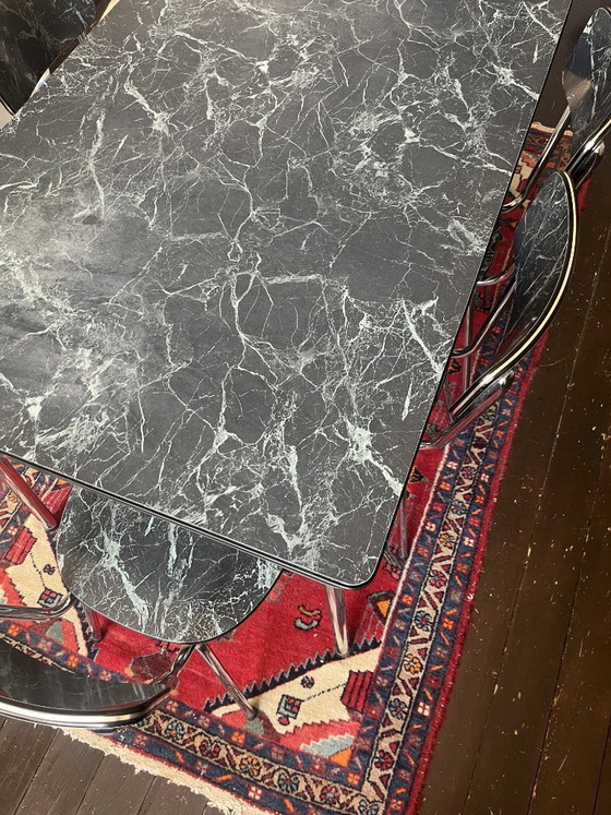 Image 1 of Vintage Formica extendable dining table with 6 chairs