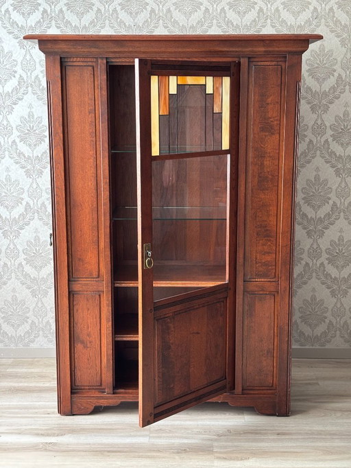 Bannink Hunters cabinet with stained glass display door and paneled side door - Craftsman Dutch furniture piece