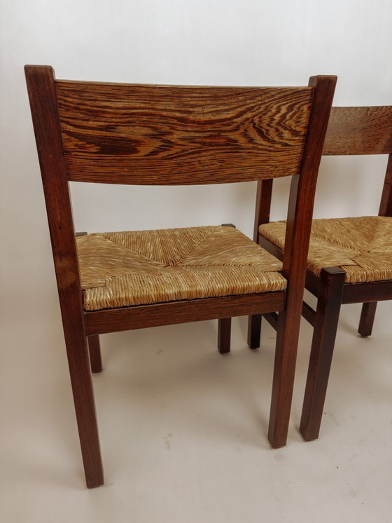 Image 1 of 2x Vintage wengé houten eetkamerstoelen met gevlochten zitting