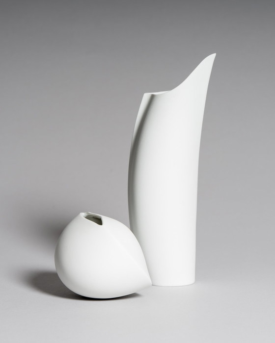 Image 1 of Curated Porcelain Duo: Lino Sabattini "Penguin" Vase (22cm) & Uta Feyl Sculptural Mini Vase – Rosenthal Studio Line, 1980s
