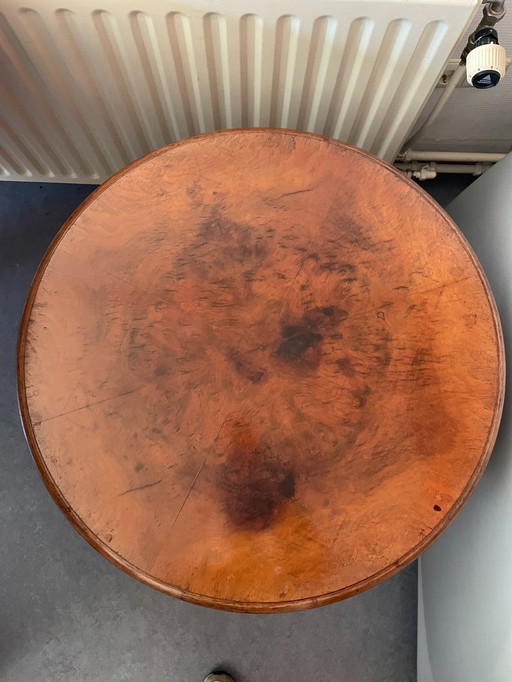 Antique round side table with claw feet