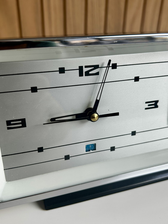 Image 1 of Vintage desk clock with flip date, made in Shanghai China.