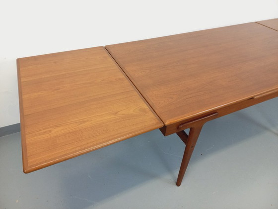 Image 1 of Vintage Scandinavian rectangular dining table by Ejvind A. Johansson from the 50s and 60s in teak with integrated extensions