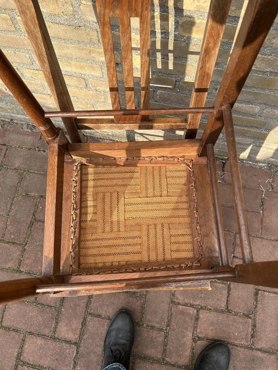 Image 1 of Dining room chairs with fabric seats and nail trim.